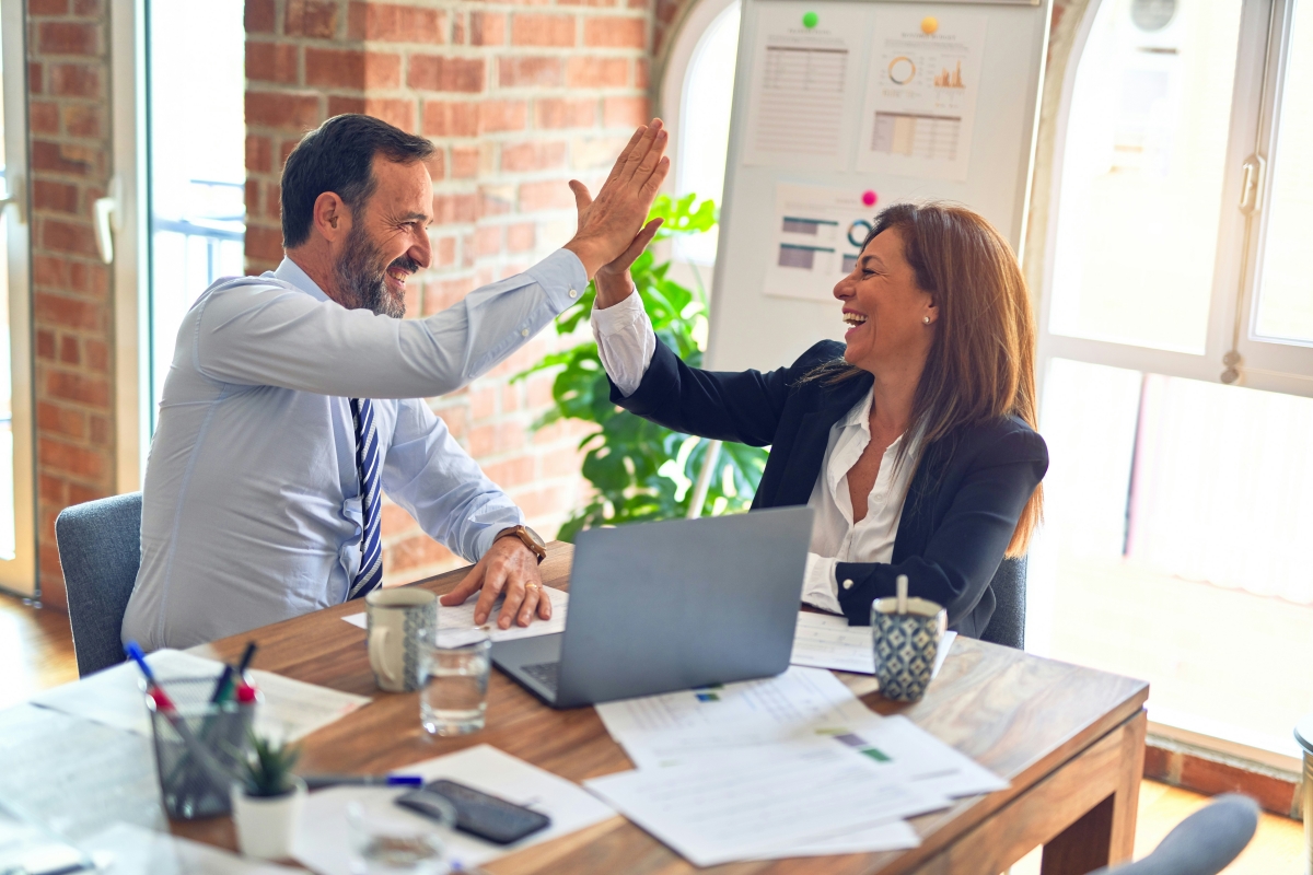 Happy business owner engaging with customers